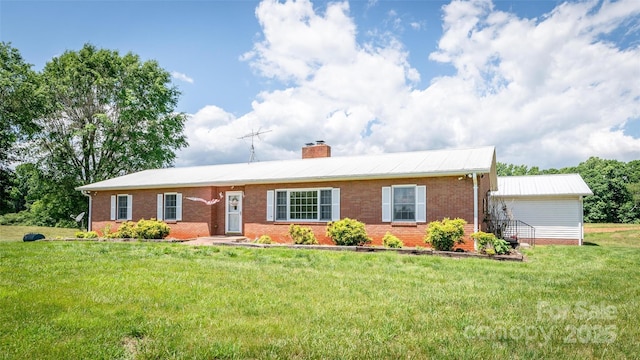 765 York Institute Rd, Hiddenite, NC 28636 - ranch-style home featuring brick siding, a chimney, a front lawn, and metal roof
