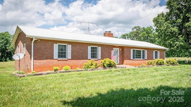 765 York Institute Rd, Hiddenite, NC 28636 - ranch-style home featuring brick siding, a chimney, and a front yard