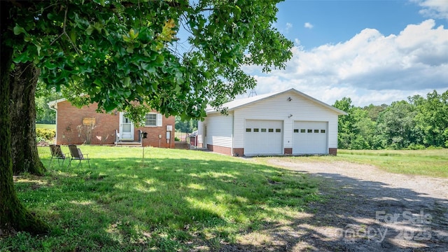 765 York Institute Rd, Hiddenite, NC 28636 - view of front of house featuring a garage, an outdoor structure, and a front yard