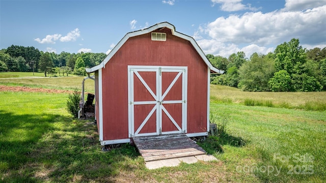765 York Institute Rd, Hiddenite, NC 28636 - view of barn featuring a lawn, a shed, and a forest view