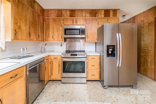 765 York Institute Rd, Hiddenite, NC 28636 - kitchen featuring appliances with stainless steel finishes, light countertops, light floors, and brown cabinetry