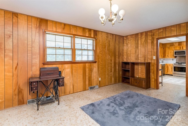 765 York Institute Rd, Hiddenite, NC 28636 - unfurnished room featuring a chandelier and wood walls