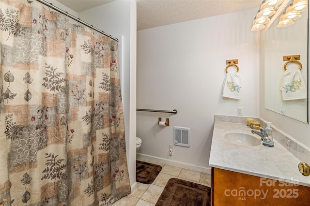 765 York Institute Rd, Hiddenite, NC 28636 - full bathroom featuring tile patterned flooring, vanity, heating unit, toilet, and baseboards