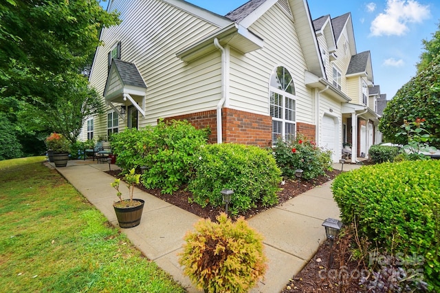 3071 Des Prez Ave, Fort Mill, SC 29707 - view of home's exterior with brick siding, roof with shingles, and a yard