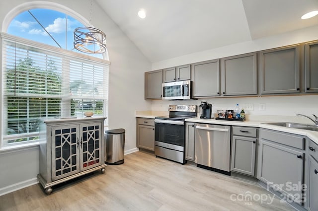 3071 Des Prez Ave, Fort Mill, SC 29707 - kitchen featuring stainless steel appliances, gray cabinetry, high vaulted ceiling, light wood-style floors, and baseboards