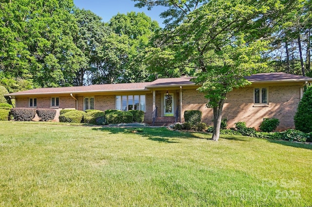 308 Odell St, Kannapolis, NC 28083 - ranch-style house featuring a front lawn and brick siding