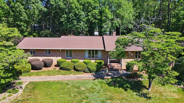 308 Odell St, Kannapolis, NC 28083 - ranch-style house featuring a front lawn and brick siding