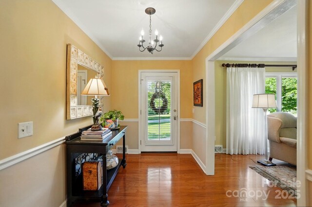 308 Odell St, Kannapolis, NC 28083 - entrance foyer featuring a chandelier, wood finished floors, ornamental molding, and baseboards
