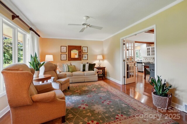 308 Odell St, Kannapolis, NC 28083 - living area featuring plenty of natural light, wood finished floors, ceiling fan, and ornamental molding