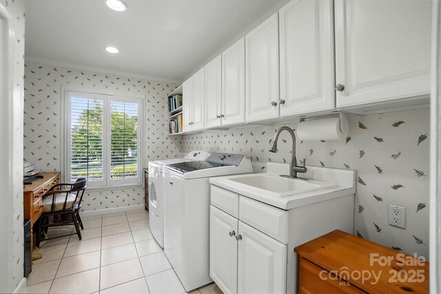 308 Odell St, Kannapolis, NC 28083 - washroom featuring ornamental molding, washer and clothes dryer, wallpapered walls, light tile patterned floors, and cabinet space