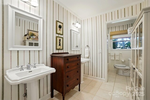 308 Odell St, Kannapolis, NC 28083 - half bathroom with tile patterned floors, wallpapered walls, toilet, and baseboards