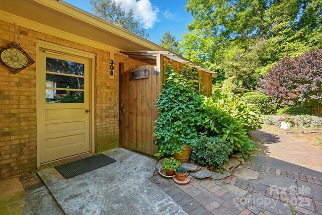 308 Odell St, Kannapolis, NC 28083 - doorway to property with brick siding