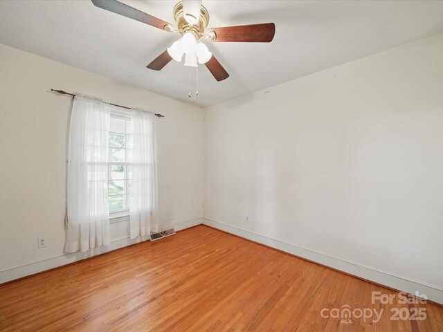 2216 Griffith Rd, Monroe, NC 28112 - spare room with light wood-style floors, baseboards, and ceiling fan
