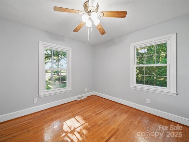 2216 Griffith Rd, Monroe, NC 28112 - empty room featuring baseboards, wood finished floors, and ceiling fan