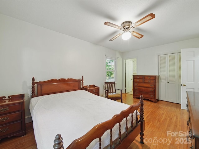 2216 Griffith Rd, Monroe, NC 28112 - bedroom with light wood-style flooring, a closet, and a ceiling fan