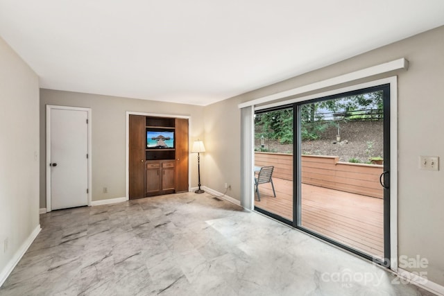 8117 Rising Meadow Rd, Charlotte, NC 28277 - unfurnished room with baseboards and marble look tile flooring