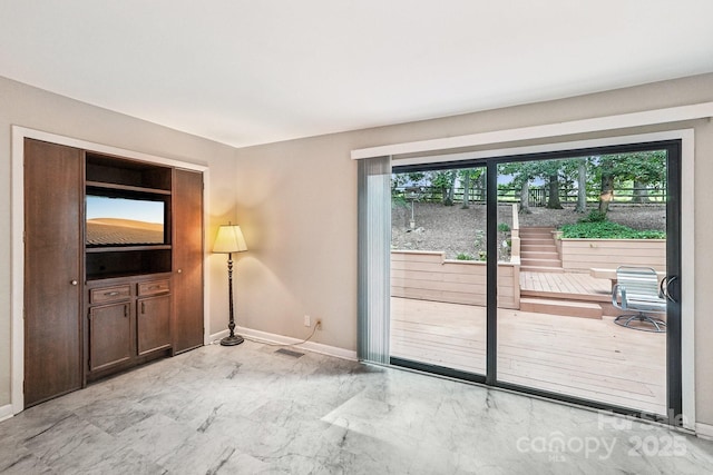 8117 Rising Meadow Rd, Charlotte, NC 28277 - unfurnished living room featuring baseboards and marble finish floors