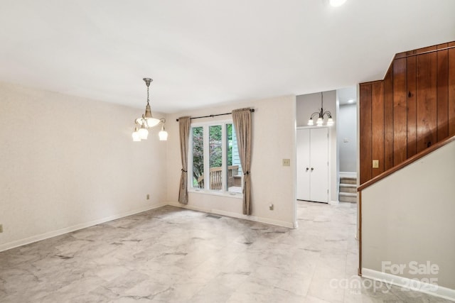 8117 Rising Meadow Rd, Charlotte, NC 28277 - spare room featuring a chandelier, light marble finish flooring, baseboards, and stairway