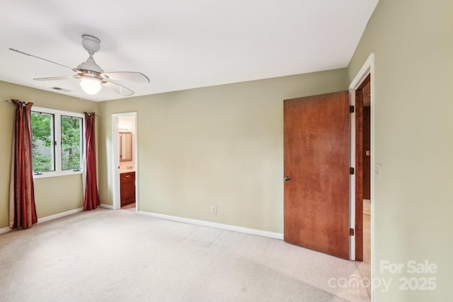 8117 Rising Meadow Rd, Charlotte, NC 28277 - unfurnished bedroom featuring baseboards, light carpet, ensuite bathroom, and ceiling fan