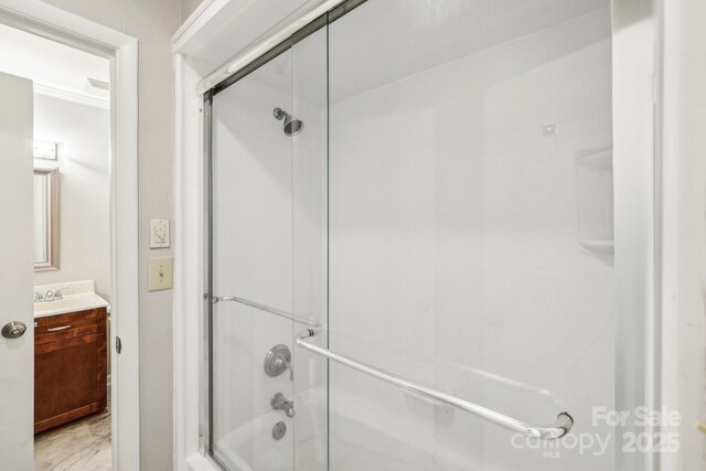 8117 Rising Meadow Rd, Charlotte, NC 28277 - bathroom with shower / bath combination with glass door, vanity, and marble look tiles
