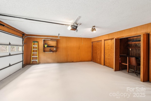 8117 Rising Meadow Rd, Charlotte, NC 28277 - garage with a garage door opener and wood walls