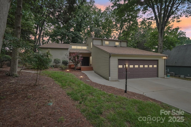 8117 Rising Meadow Rd, Charlotte, NC 28277 - mid-century home with concrete driveway and a garage