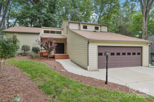 8117 Rising Meadow Rd, Charlotte, NC 28277 - mid-century inspired home with concrete driveway, an attached garage, and a shingled roof