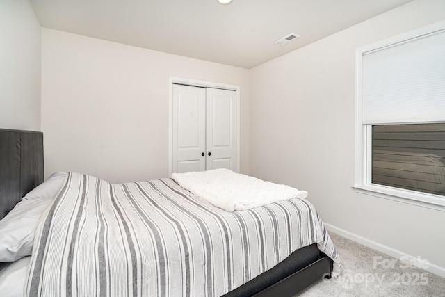 16018 River Tree Ln, Charlotte, NC 28278 - carpeted bedroom with a closet and baseboards