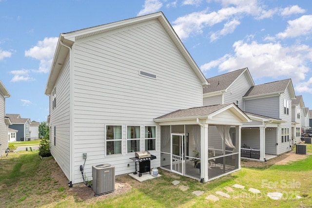 16018 River Tree Ln, Charlotte, NC 28278 - rear view of house with a sunroom, central AC, and a yard
