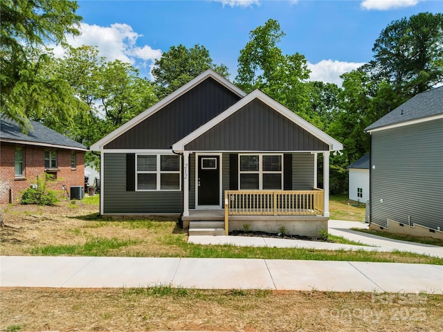 212 N Correll St, Landis, NC 28025 - bungalow-style house featuring board and batten siding, covered porch, and cooling unit