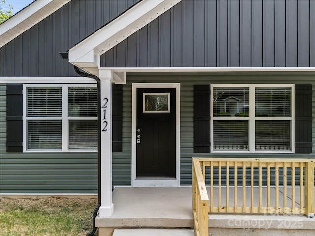 212 N Correll St, Landis, NC 28025 - property entrance with covered porch and board and batten siding
