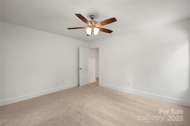212 N Correll St, Landis, NC 28025 - unfurnished room featuring light colored carpet, ceiling fan, and baseboards
