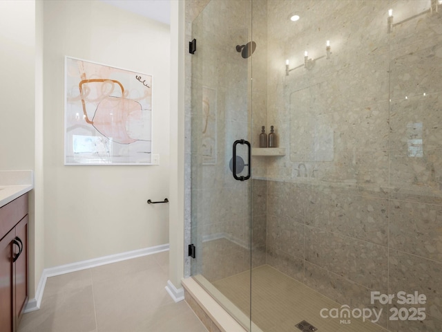 5508 Swaling St, Charlotte, NC 28217 - bathroom featuring vanity, a shower stall, baseboards, and tile patterned floors