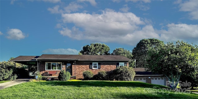 1515 Fairway Acres Rd, Lenoir, NC 28645 - view of front facade with brick siding, driveway, a front yard, an attached carport, and a garage