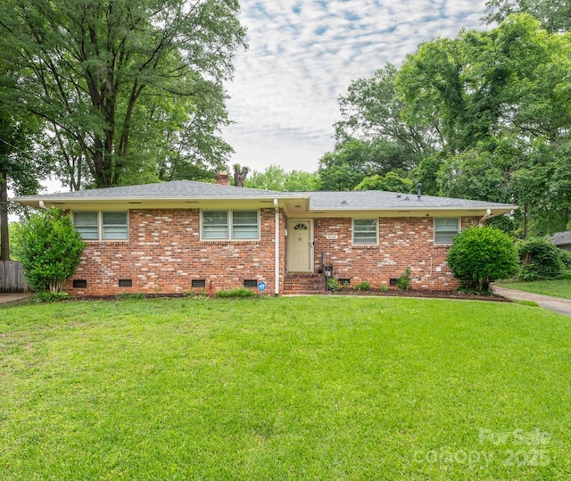 5629 Ruth Dr, Charlotte, NC 28215 - single story home with crawl space, a front lawn, a chimney, and brick siding