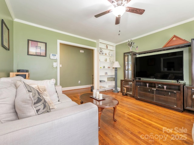 5629 Ruth Dr, Charlotte, NC 28215 - living room with ceiling fan, crown molding, and light wood-style flooring