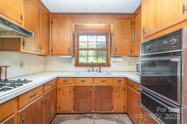 3526 Craig Ave, Charlotte, NC 28211 - kitchen featuring a sink, under cabinet range hood, oven, a warming drawer, and light countertops