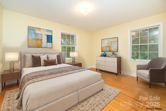 3526 Craig Ave, Charlotte, NC 28211 - bedroom featuring light wood finished floors, baseboards, and multiple windows
