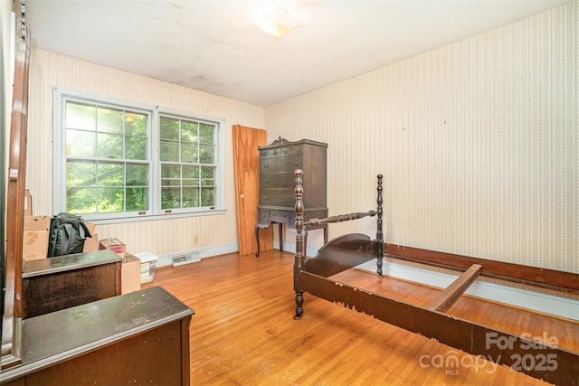 3526 Craig Ave, Charlotte, NC 28211 - bedroom with light wood-style floors, wallpapered walls, and baseboards