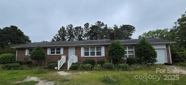 116 E Graves St, Candor, NC 27229 - single story home with brick siding, a garage, and a chimney