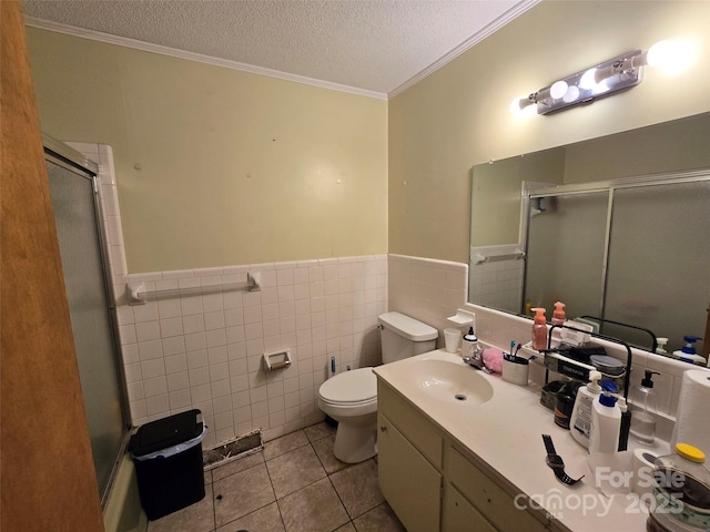 116 E Graves St, Candor, NC 27229 - bathroom featuring an enclosed shower, toilet, a textured ceiling, vanity, and ornamental molding