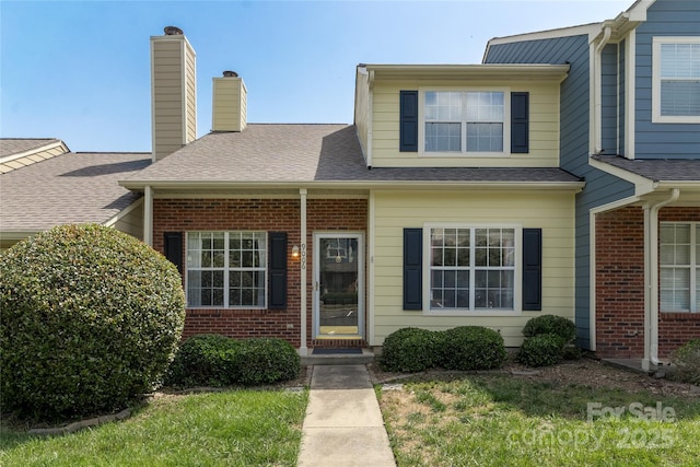 9006 Four Mile Creek Rd, Charlotte, NC 28277 - view of front of home featuring brick siding, a chimney, and roof with shingles