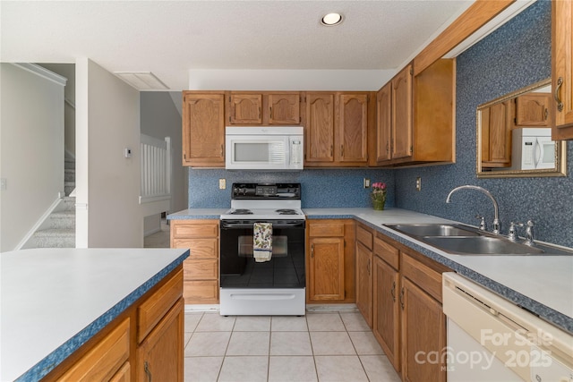 9006 Four Mile Creek Rd, Charlotte, NC 28277 - kitchen with white appliances, a sink, brown cabinetry, and decorative backsplash