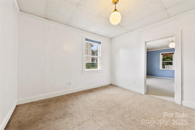 217 S Highland St, Gastonia, NC 28052 - spare room featuring carpet flooring, ornamental molding, and baseboards