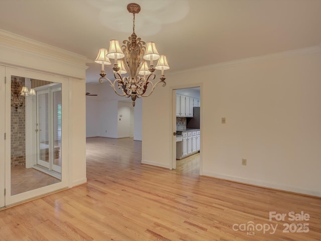 8 Sunrise Point Rd, Lake Wylie, SC 29710 - empty room featuring a chandelier, light wood-style floors, crown molding, and baseboards