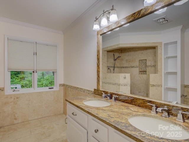8 Sunrise Point Rd, Lake Wylie, SC 29710 - bathroom with tile walls, crown molding, tiled shower, double vanity, and wainscoting