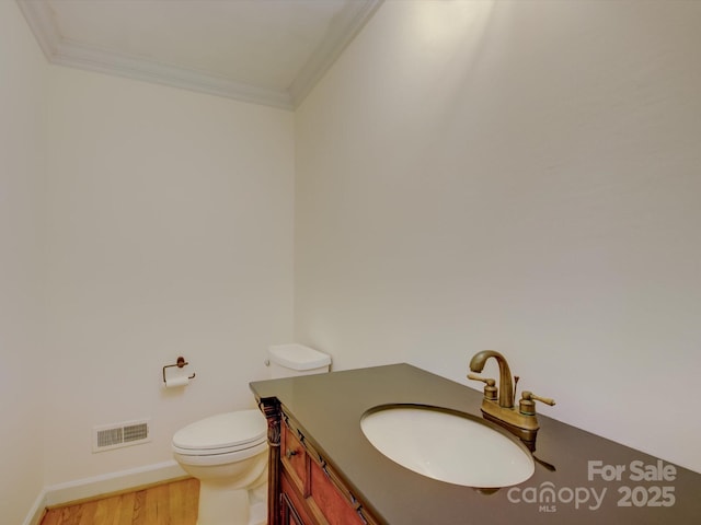 8 Sunrise Point Rd, Lake Wylie, SC 29710 - half bathroom with crown molding, vanity, toilet, wood finished floors, and baseboards
