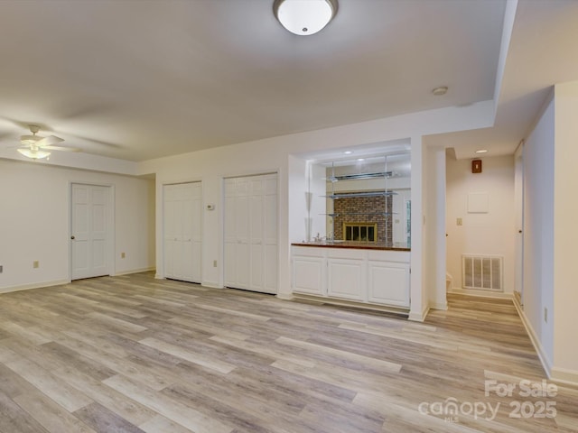8 Sunrise Point Rd, Lake Wylie, SC 29710 - unfurnished living room featuring ceiling fan, light wood-style flooring, and baseboards