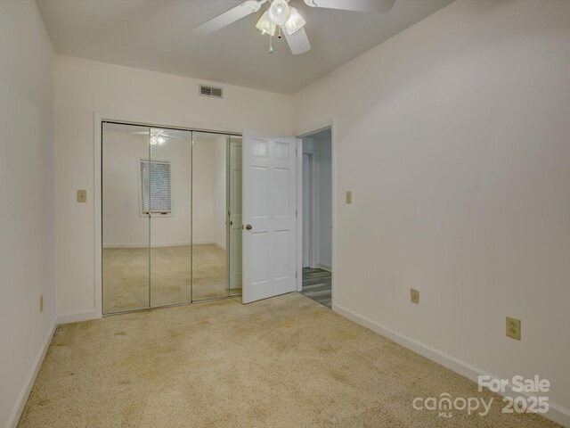 8 Sunrise Point Rd, Lake Wylie, SC 29710 - unfurnished bedroom featuring carpet, baseboards, a ceiling fan, and a closet