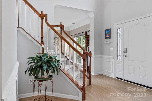 16018 Hollingbourne Rd, Huntersville, NC 28078 - foyer entrance featuring wood finished floors, stairs, and ornamental molding